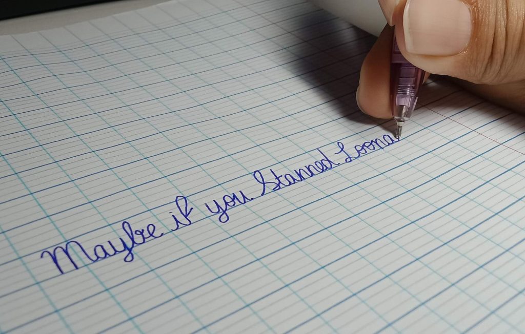 Reclaiming Attention: The Psychology of Deep Focus A person writing in a notebook at a tidy desk